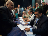 Emad zaanoun, whose son was killed in 2007 during clashes between the rival Hamas and Fatah factions, signs a social reconciliation agreemen...