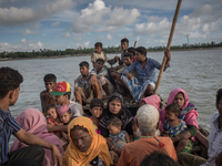 Rohingya refugees are crossing river by boat, Shahpirer Dip, Teknaf, Bangladesh; September 14, 2017. Bangladesh will use troops to deliver f...
