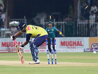 World XI batsman Tamim Iqbal is bowled out by Pakistani bowler Usman Shinwari during the third and final Twenty20 International match betwee...