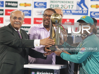Pakistani cricketers skipper Sarfraz  receiving trophy from Chairman Pakistan Cricket board  Najam Sethi  after winning the Twenty20 Interna...