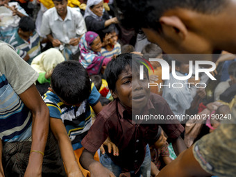 Myanmar Rohingya Refugees boy cry to get relief in Ukhiya, Bangladesh 14 September 2017. According to United Nations more than 300 thousand...