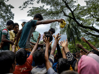 Myanmar Rohingya Refugees raise their hands to get relief in Ukhiya, Bangladesh 14 September 2017. According to United Nations more than 300...