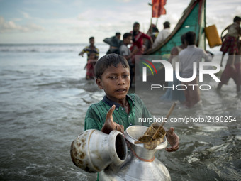 Myanmar Rohingya refugee boy are seen after arriving on a boat to Bangladesh on Shah Porir Dip Island Teknaf, Bangladesh 14 September 2017....