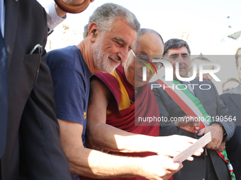 Mayor of Messina Renato Accorinti (L) with The Dalai Lama, Tenzin GYATSO at the Greek Theatre in Taormina, Italy on 16 September 2017. The s...