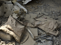 Explosive remnants of war in a bombed out IED factory in East Mosul. Body armour left at the factory. Mosul, Iraq, on 11 September 2017. Isl...