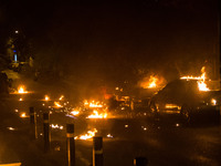 Cars in flames from molotof coctails during an anti-fascism demonstration in Athens on September 16, 2017 (