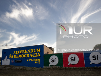 In the village of Tona (50 kms. north Barcelona), Spain, a mural  painted on the wall of a house reading 'Referendum is Democracy' and claim...
