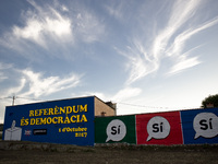 In the village of Tona (50 kms. north Barcelona), Spain, a mural  painted on the wall of a house reading 'Referendum is Democracy' and claim...