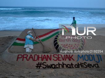 Indian sand artist Sudarshan Patnaik has creating a sand sclupture for visitors awareness about the Prime Minister of India Narendra Modi's...