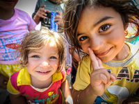 Young girls play at a refugee camp in Zahko. The UN announces a major aid campaign to help thousands of refugees & internally displaced pers...