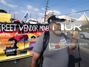 People protest harassment and attacks on street vendors in Los Angeles, California on September 16, 2017. (Photo by: Ronen Tivony) (
