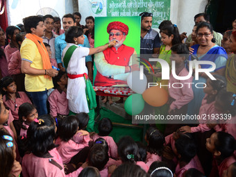 Indian Students of Primary school take part in an event on the eve of Indan Prime Minister Narendra Modi's Birthday , in Ram Nagar Chowk , v...