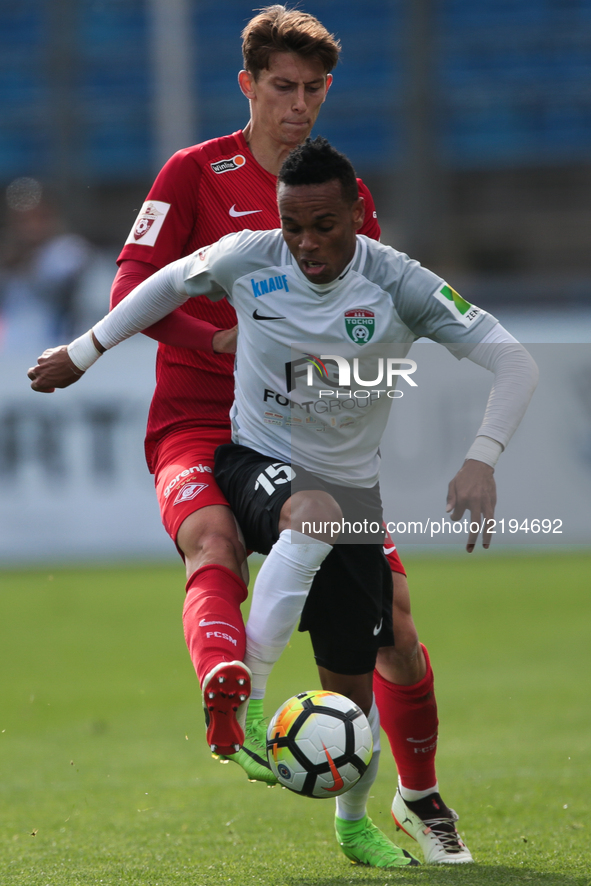 Nuno Rocha (R) of FC Tosno and Ilya Kutepov of FC Spartak Moscow vie for the ball during the Russian Football League match between FC Tosno...