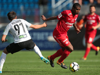 Yan Kazayev of FC Tosno and Fernando (R) of FC Spartak Moscow vie for the ball during the Russian Football League match between FC Tosno and...