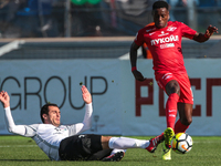  Aslan Dudiyev (L) of FC Tosno and Quincy Promes of FC Spartak Moscow vie for the ball during the Russian Football League match between FC T...
