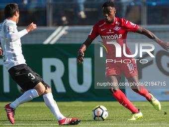 Aslan Dudiyev (L) of FC Tosno and Quincy Promes  of FC Spartak Moscow vie for the ball during the Russian Football League match between FC T...