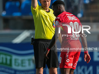 Referee shows the yellow cards to Quincy Promes during the Russian Football League match between FC Tosno and FC Spartak Moscow at Petrovsky...