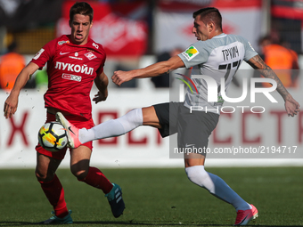 Nikola Trujic (L) of FC Tosno and Mario Pasalic of FC Spartak Moscow vie for the ball during the Russian Football League match between FC To...