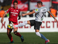 Nikola Trujic (L) of FC Tosno and Mario Pasalic of FC Spartak Moscow vie for the ball during the Russian Football League match between FC To...