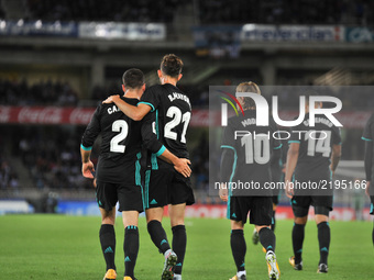 Real Madrid players celebrate their first goal during the Spanish league football match Real Sociedad vs Real Madrid CF at the Anoeta stadiu...