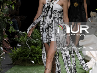 A model takes to the catwalk with a creation for Spring-Summer 2018 Collection of Alvarno  during of the Madrid Fashion Week, in Madrid, Spa...