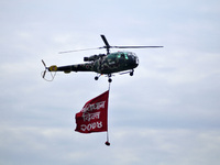Nepalese Army Helicopter pass by carrying program flag during celebration of Constitution Day at Nepal Army Pavilion, Tundikhel, Kathmandu,...