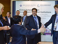 Global Symposium on Development Financial Institutions participants are greeting at the entrance of the auditorium at Sasana Kijang in Kuala...