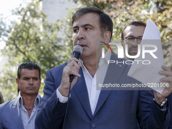 Former Georgian President and former Odessa Region Governor Mikheil Saakashvili (C) and his lawyers in front of the Presidential Office buil...