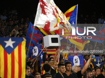 catalan supporters with catalan flags and one urn during La Liga match between FC Barcelona v SC Eibar , in Barcelona, on September 19, 2017...
