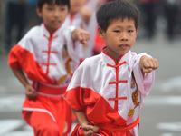 Young athletes during a kung fu demonstration ahead of the start to the the opening stage of the 2017 Tour of China 2, the 118.6 km Huaihua...