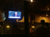 Palestinians watch on a TV the Palestinian President Mahmoud Abbas during speaks the General Debate of the 72nd United Nations General Assem...