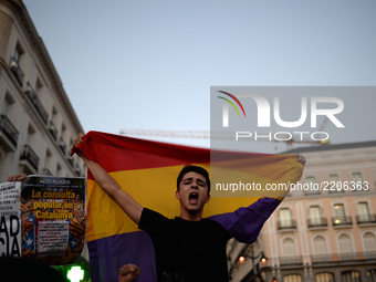 A young person with the republican flag during the demonstration for the freedoms and the right to decide in Madrid on 20th September, 2017....