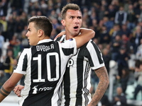Mario Mandzukic (Juventus FC) celebrates with Paulo Dybala (Juventus FC) after scoring the goal of the win during the Serie A football match...