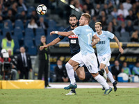 Ciro Immobile of Lazio is challenged by Ral Albiol of Napoli during the Serie A match between Lazio and Napoli at Olympic Stadium, Roma, Ita...