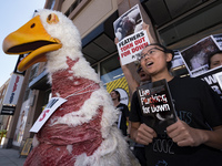 PETA animal rights activists protest Bed Bath & Beyond for selling down products.  Los Angeles, California on September 20, 2017. According...