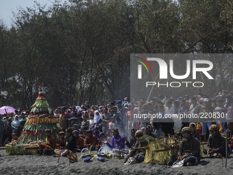 Javanese people follow the ritual ceremony of labuhan 1st Suro (Javanese calendar) during the Islamic New Year celebration at Goa Cemara bea...