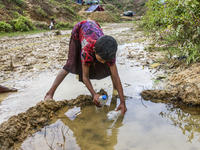 Balukhali camp resident collects drinking water from mud and clay as the supply of drinking water is inadequate. They dug a 3 to 4 feet circ...