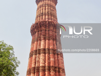 Qutub Minar tower in Delhi, India. Qutub Minar is a 73-metre (240 feet) tall tower that was built along with the Quwwat-ul-Islam Mosque arou...