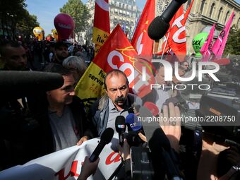 Philippe Martinez (C), Secretary General of the General Confederation of Labour attends a national demonstration against the French governme...