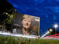 A vandalized election poster of German Chancellor Angela Merkel (CDU) painted with a Hitler-like moustache is pictured in the district of Fr...