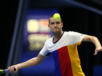 Mikhail Youzhny of Russia returns the ball to Fabio Fognini of Italy during the St. Petersburg Open ATP tennis tournament match in St. Peter...