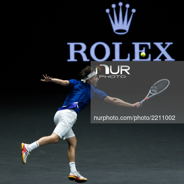 Team Europe player Dominic Thiem of Austria returns the ball to Team World player John Isner of United States during the first day at Laver...
