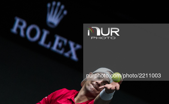 Team World player John Isner of United States serves against Team Europe player Dominic Thiem of Austria during the first day at Laver Cup o...
