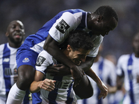 Porto's Spanish defender Ivan Marcano celebrates after scoring goal with teammate Porto's Cameroonian forward Vincent Aboubakar during the P...