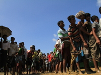 Rohingya Muslims gather for relief materials at a refugee camp in Teknaf, Bangladesh on September 22, 2017.  More than 400,000 Rohingya Musl...