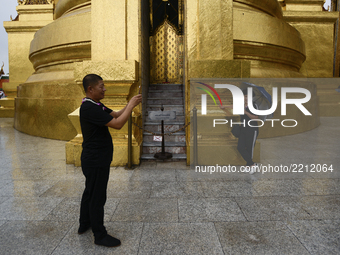 A Chinese tourist group visits the Emerald Buddha Temple inside the Grand Palace in Bangkok, Thailand, 23 September 2017.  The Grand Palace...