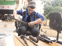 Training young people to unpack weapon, in Aleppo, Syria, on November 6, 2013. The death toll from the war in Syria has topped 191,000, UN r...