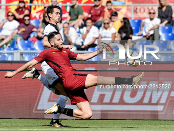Kostas Manolas of Roma challenges Kevin Lasagna of Udinese during the Serie A match between Roma and Udinese at Olympic Stadium, Roma, Italy...