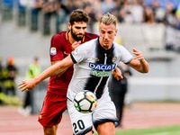 Maxi Lpez of Udinese is challenged by Federico Fazio of Roma during the Serie A match between Roma and Udinese at Olympic Stadium, Roma, Ita...