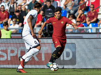 Diego Perotti of Roma is challenged by Gabriele Angella of Udinese during the Serie A match between Roma and Udinese at Olympic Stadium, Rom...